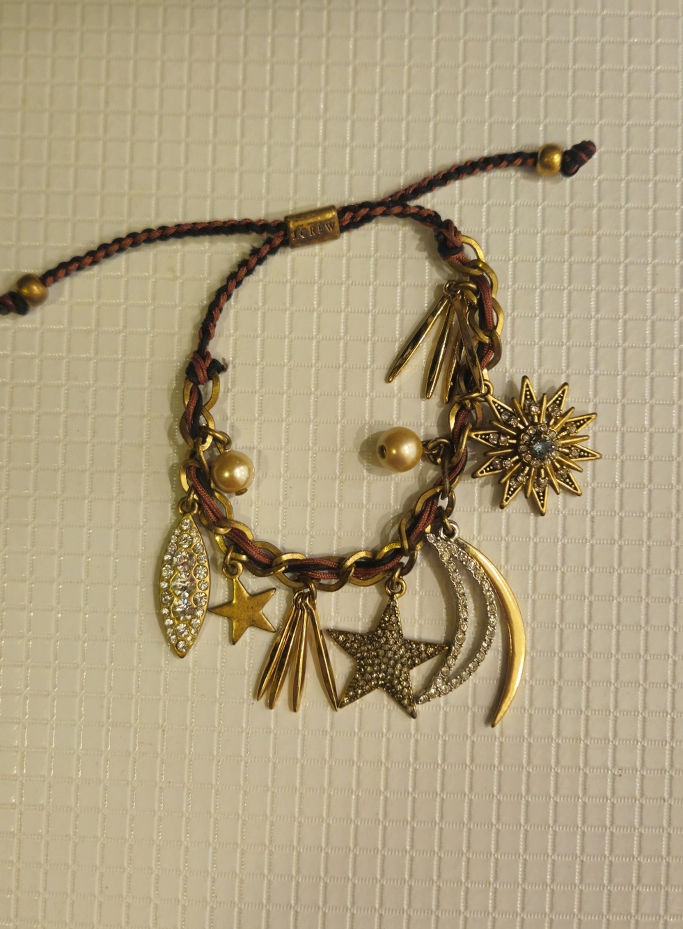 J. Crew Gold Charm Bracelet with Star and Sun Motifs